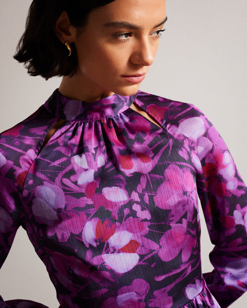 SAMMIEH-Dresses-Hello, gorgeous. SAMMIEH is the ultimate in flirty flower power. Featuring frills, cut outs and a vibrant floral print, this mini dress is just as at home with chunky boots as it is with sky high heels.The fabric of this product is made of 100% recycled polyester. Using recycled polyester helps divert plastic waste from ending in landfills and helps us to reduce our dependancy on virgin materials. Mini dress Floral print Fit and flare Long sleeved with frill cuffs High neck Zip fastening Tie